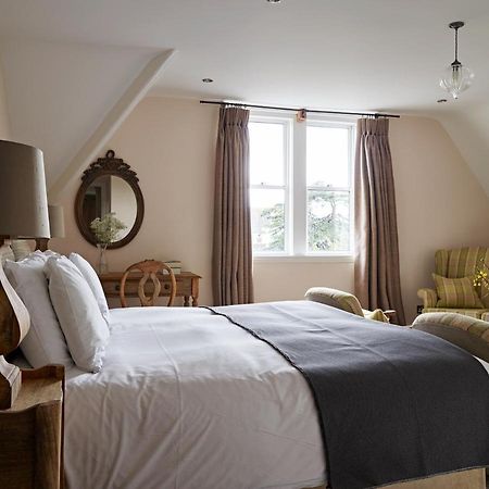 Cotswold Grange Cheltenham Exterior foto A bedroom at The Pig